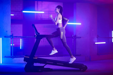 woman running on incline treadmill