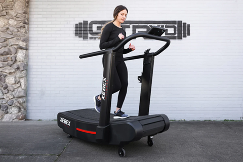 woman running on incline treadmill