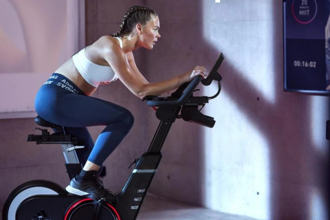 woman working out on indoor exercise bike