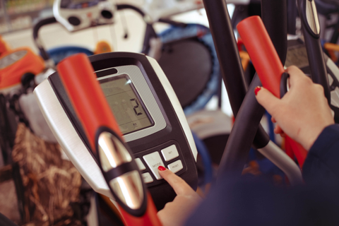 Woman operating a treadmill