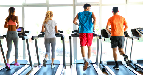 People running on treadmill at gym