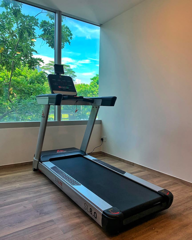 treadmill placed in a nature friendly room