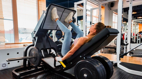 woman working out on leg machine