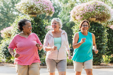 three older women walking for exercise