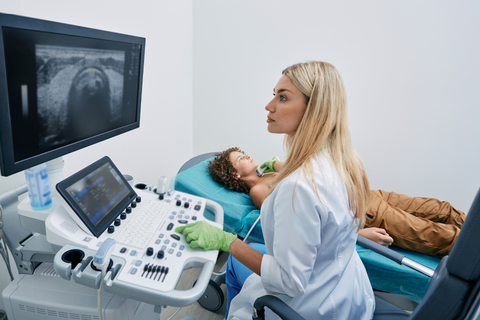woman having an ultrasound of thyroid