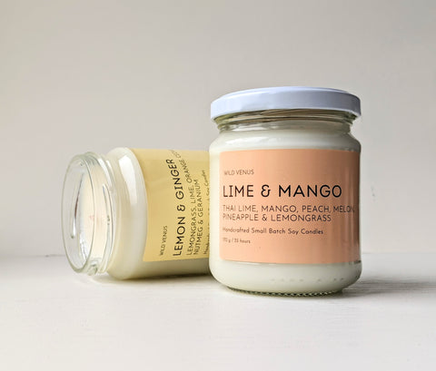 Lemon and Ginger Scented Soy Candle behind a Lime and Mango Scented Soy Candle