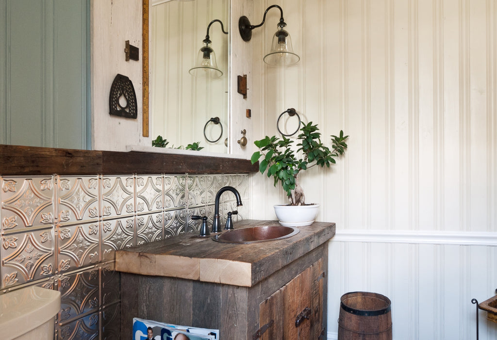 Small bath with single sink in a corner.