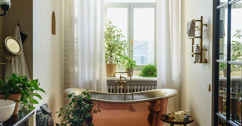 Copper clawfoot tub in a luxury bathroom.