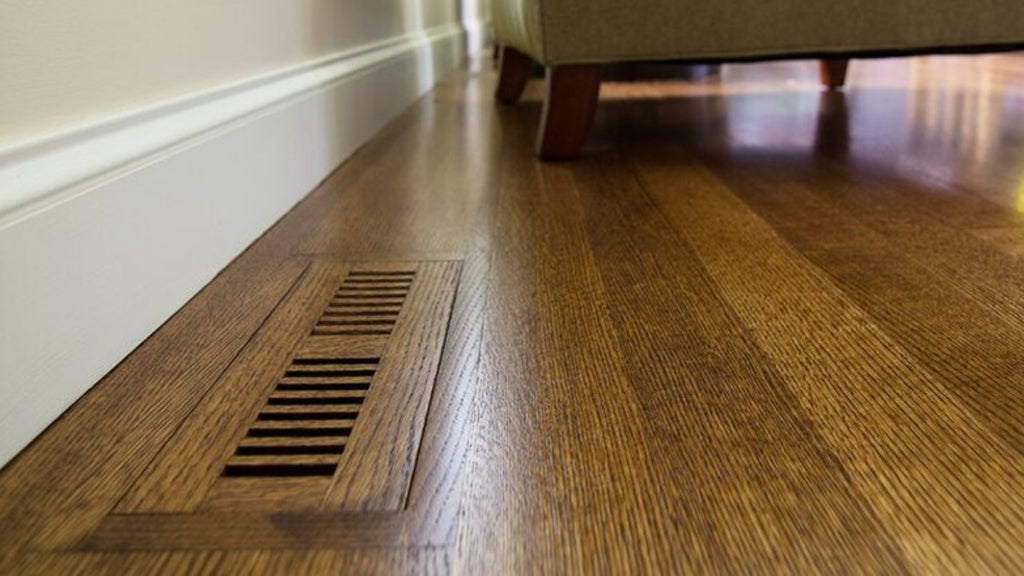 Wood vent cover that perfectly matches the wood floor in which it is installed.