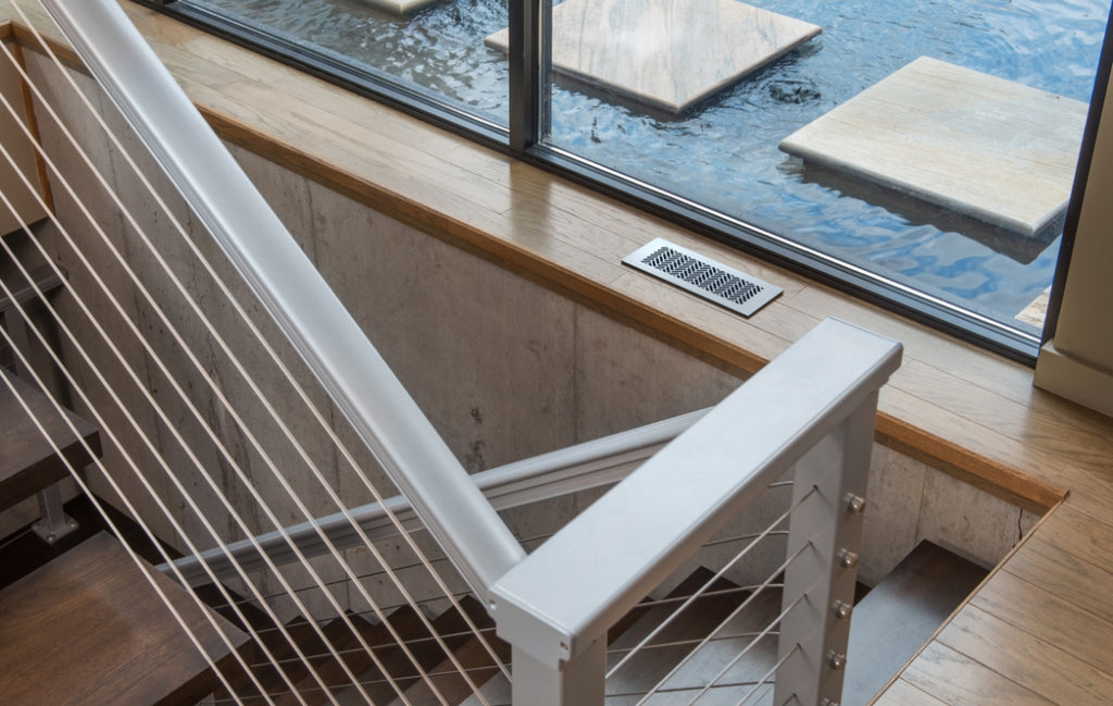 Industrial style interior staircase with metal railings.