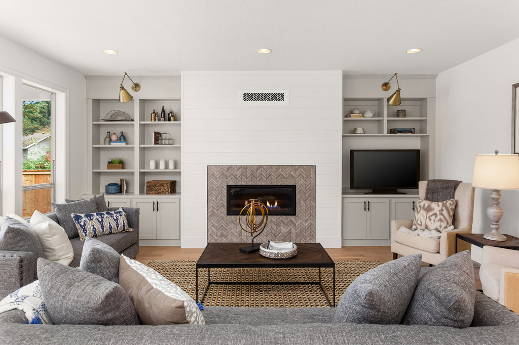 Large living room with a chevron pattern in the brick on the fireplace.