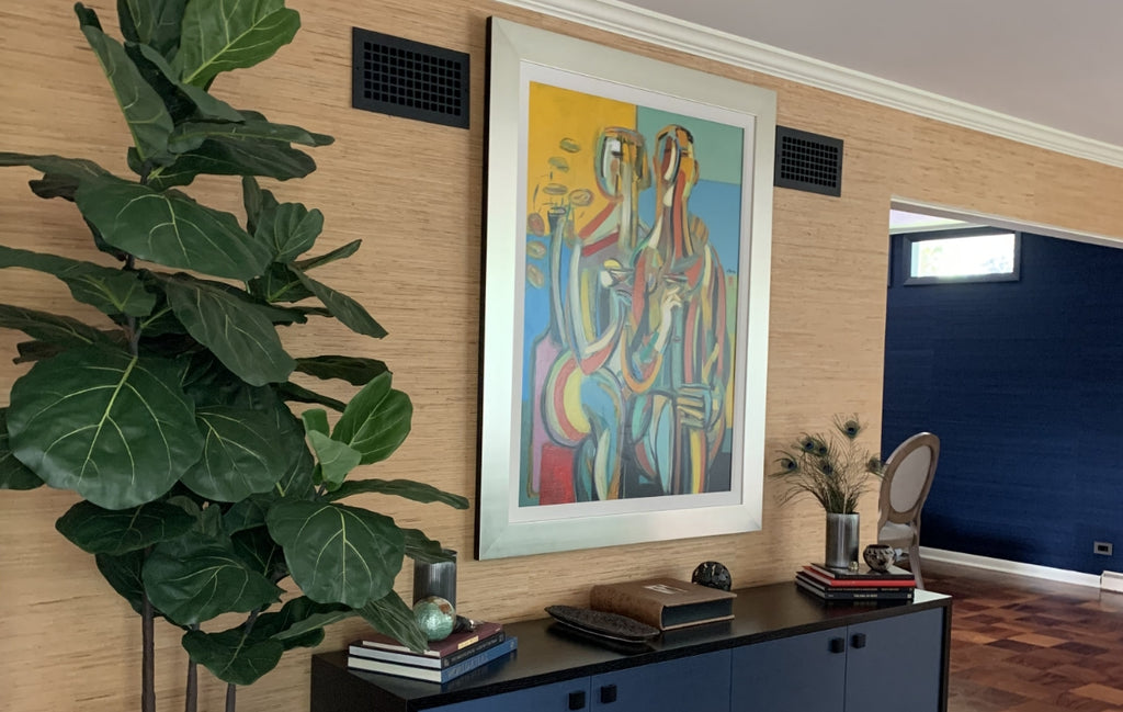 Mid-Century Modern styled space with black registers in the wall near the ceiling.