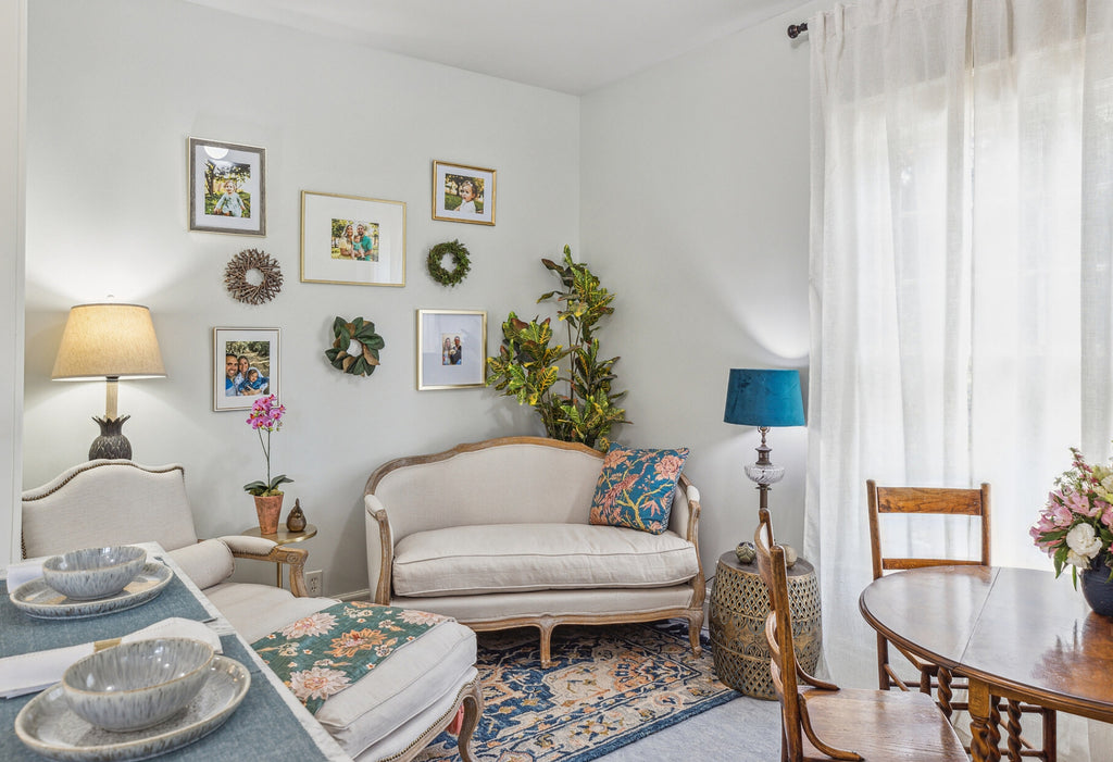 Vintage styled living room with white walls with green and natural wood accents.