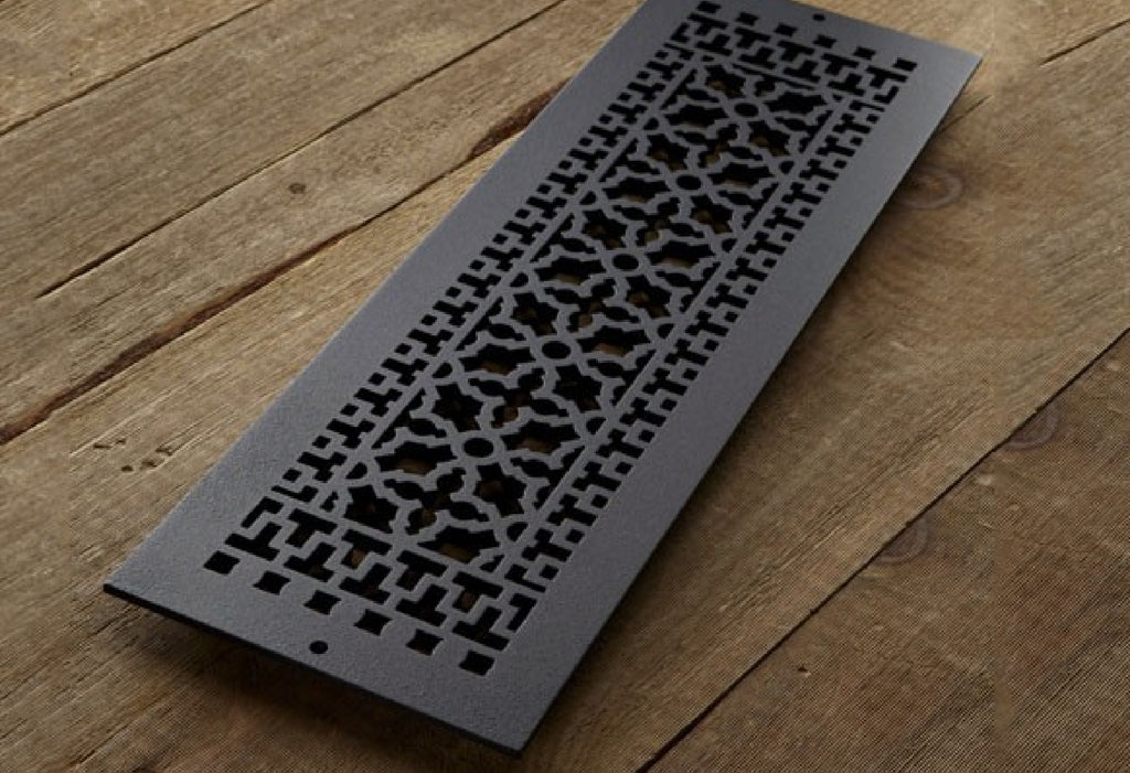 Close up of cast iron grille in Scroll pattern.