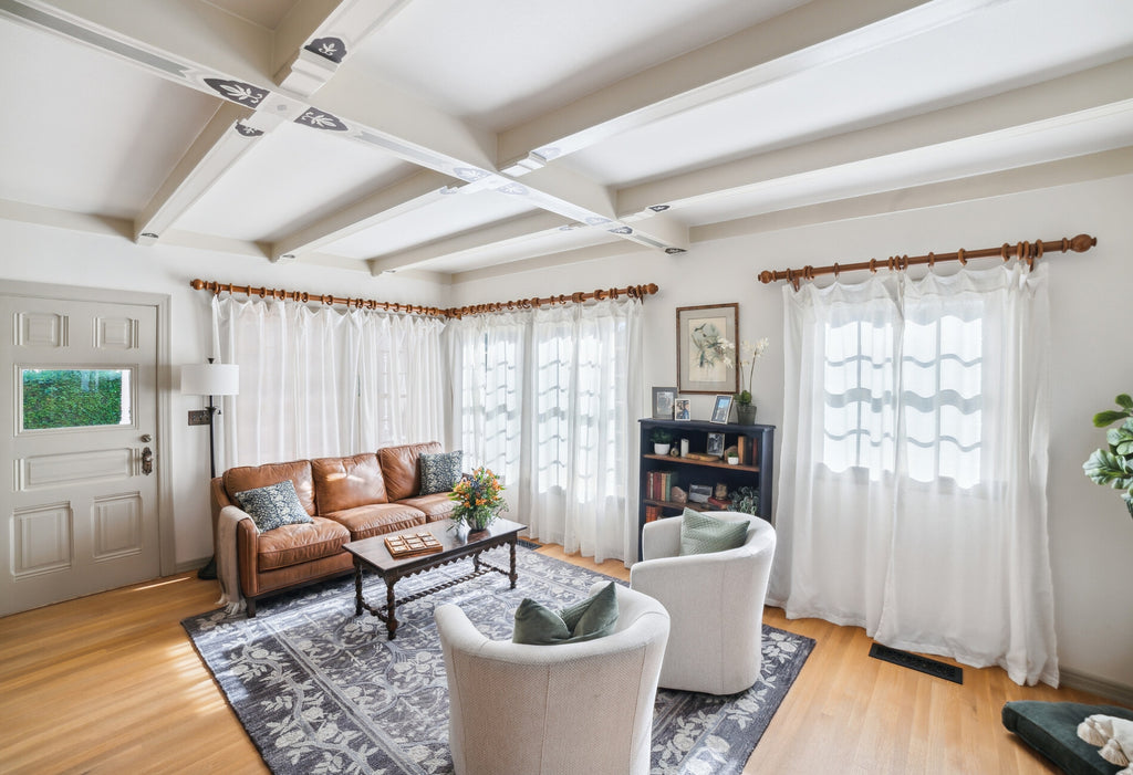 Large living room with modern and vintage style furnishings and decor.