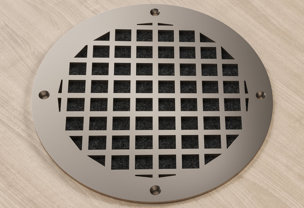 Close up of a round vent cover in a square pattern.