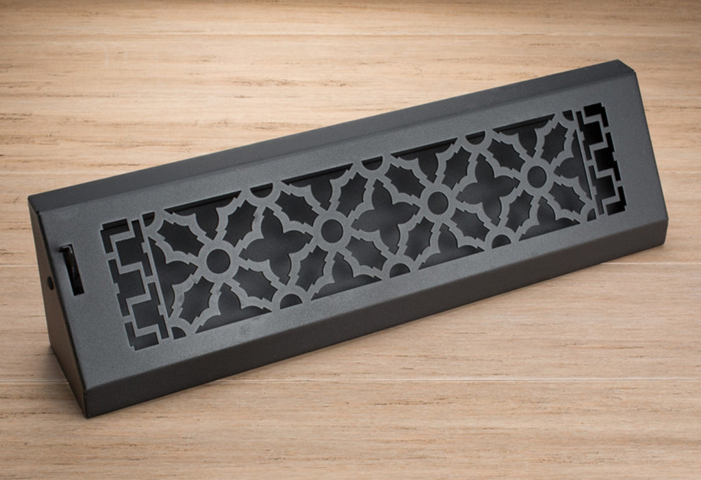 Close up of a baseboard heater vent cover in a Scroll pattern.