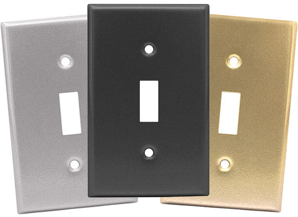 Three switch plates in silver, black, and gold.