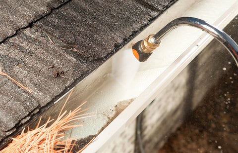 cleaning gutters with garden hose