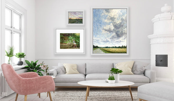 Impressionist paintings on wall of white living room