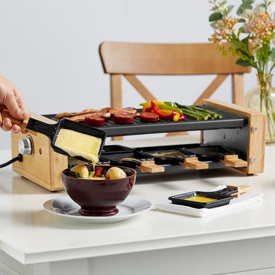 https://cdn.shopify.com/s/files/1/0622/9360/6569/products/raclette-grill-stone-cheese-melting_400x400.jpg?v=1664125581