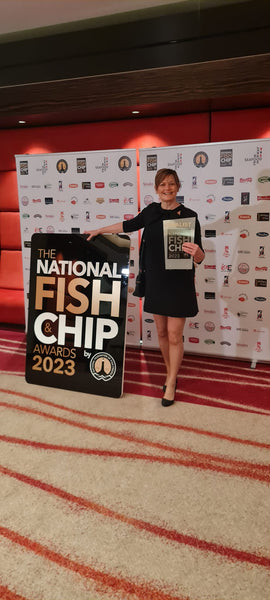 Sarah Heward with The Real Food Cafe's Fish & Chip's trophy