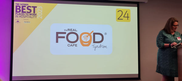 The real food cafe is named the 24th best employer in the uk hospitality sector - a presentation slide announcing the award