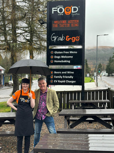 Imogen Atkinson the top 6 young fish Frier of the year with Austen Duck outside the Real Food Cafe in Tyndrum celebrating National Fish & Chip awards achievement