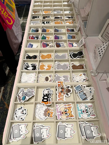 row of stickers in bins on table