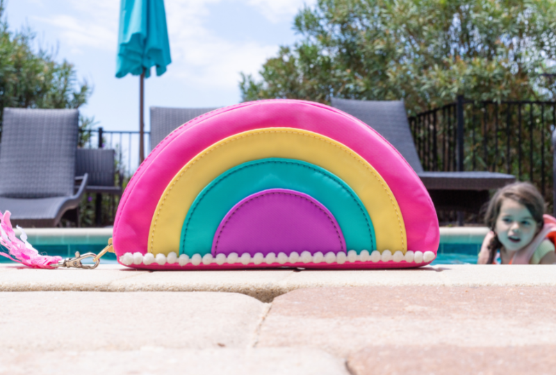 rainbow tote and kid in pool