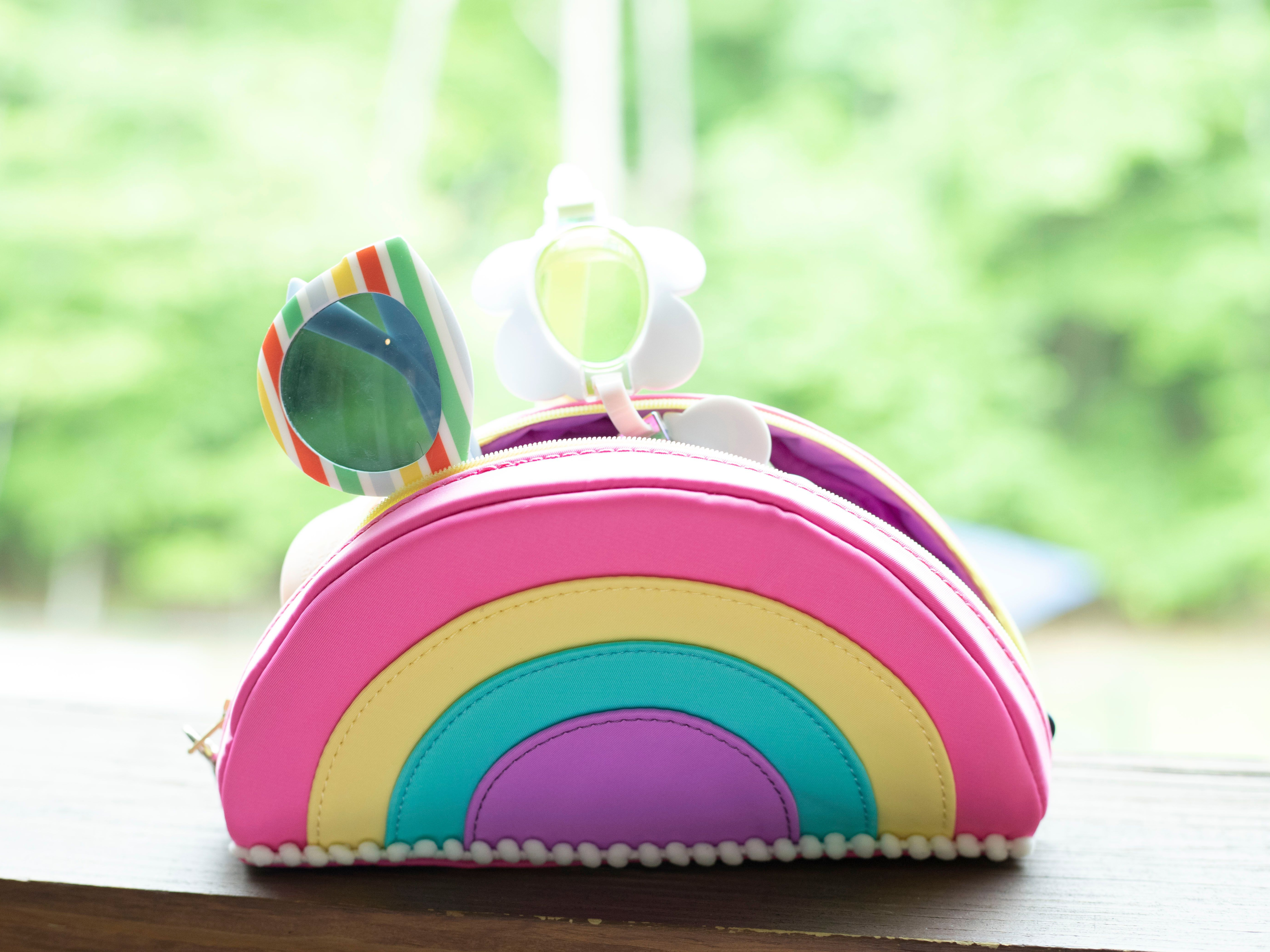 rainbow tote with sunglasses and swimming goggles