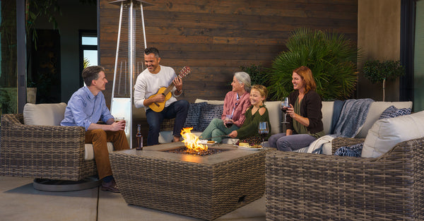 Man playing ukelele with family on outdoor patio set from SunVilla Home