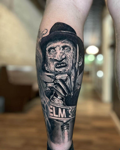 black and grey Freddy tattoo