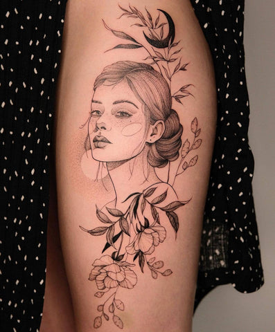 Fine line tattoo of flowers and the lady