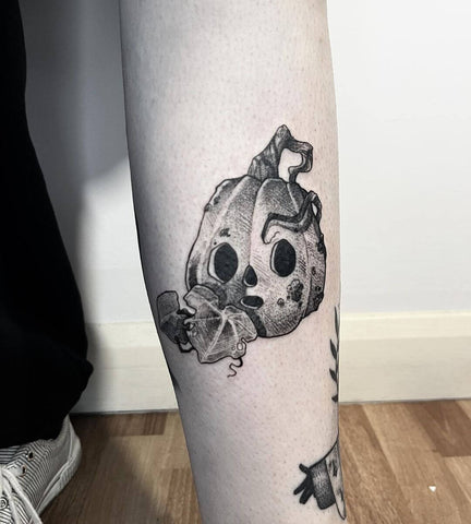 black and grey pumpkin Halloween tattoo