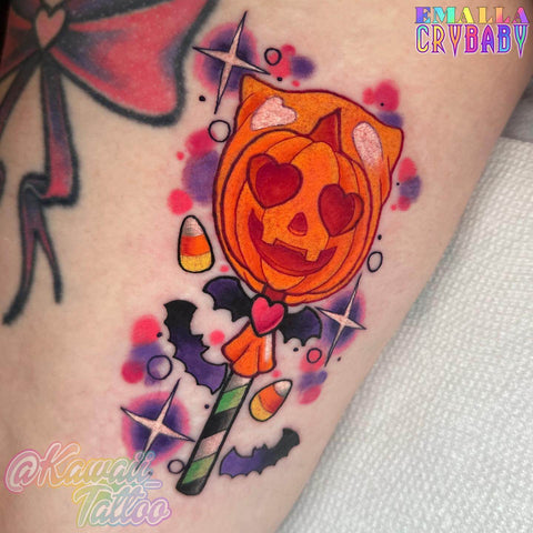 adorable pumpkin lollipop tattoo