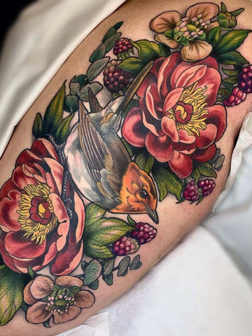 Botanica and Robin neotraditional colorful tattoo
