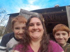 Linda and her two boys on their farm