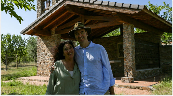 couple standing on winery