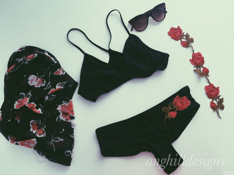 black floral bikini flat lay