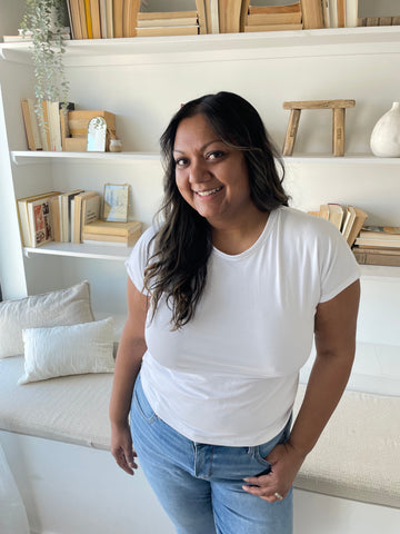 woman wearing a white bamboo t-shirt and jeans