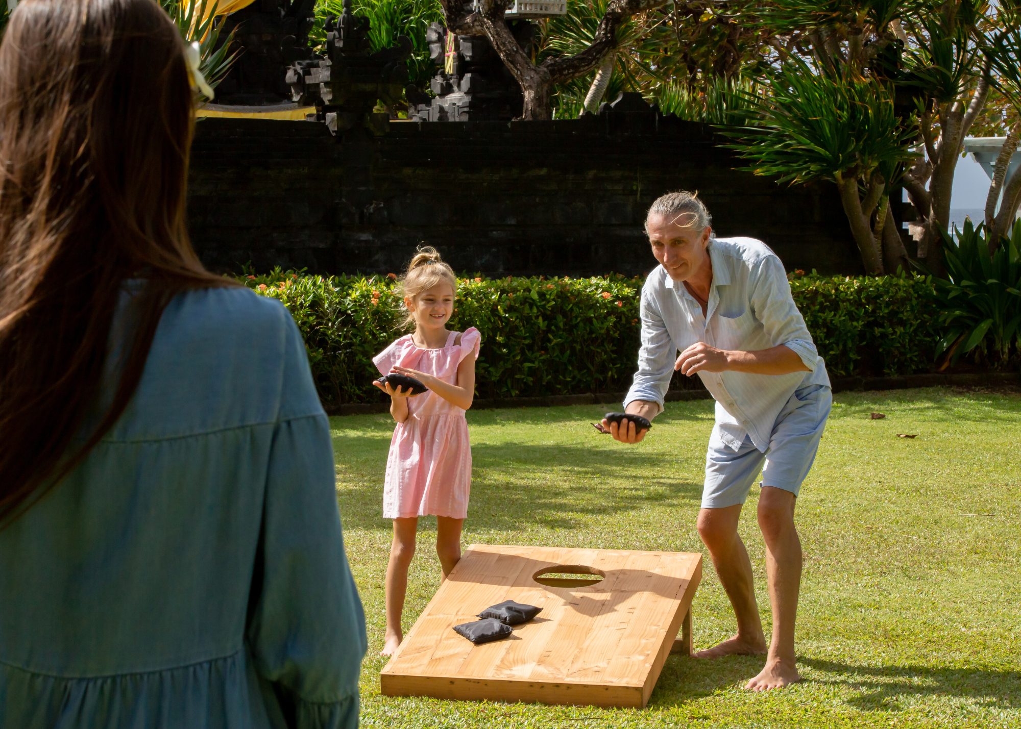 Grandfather and Granddaughter Playing Cornhole
