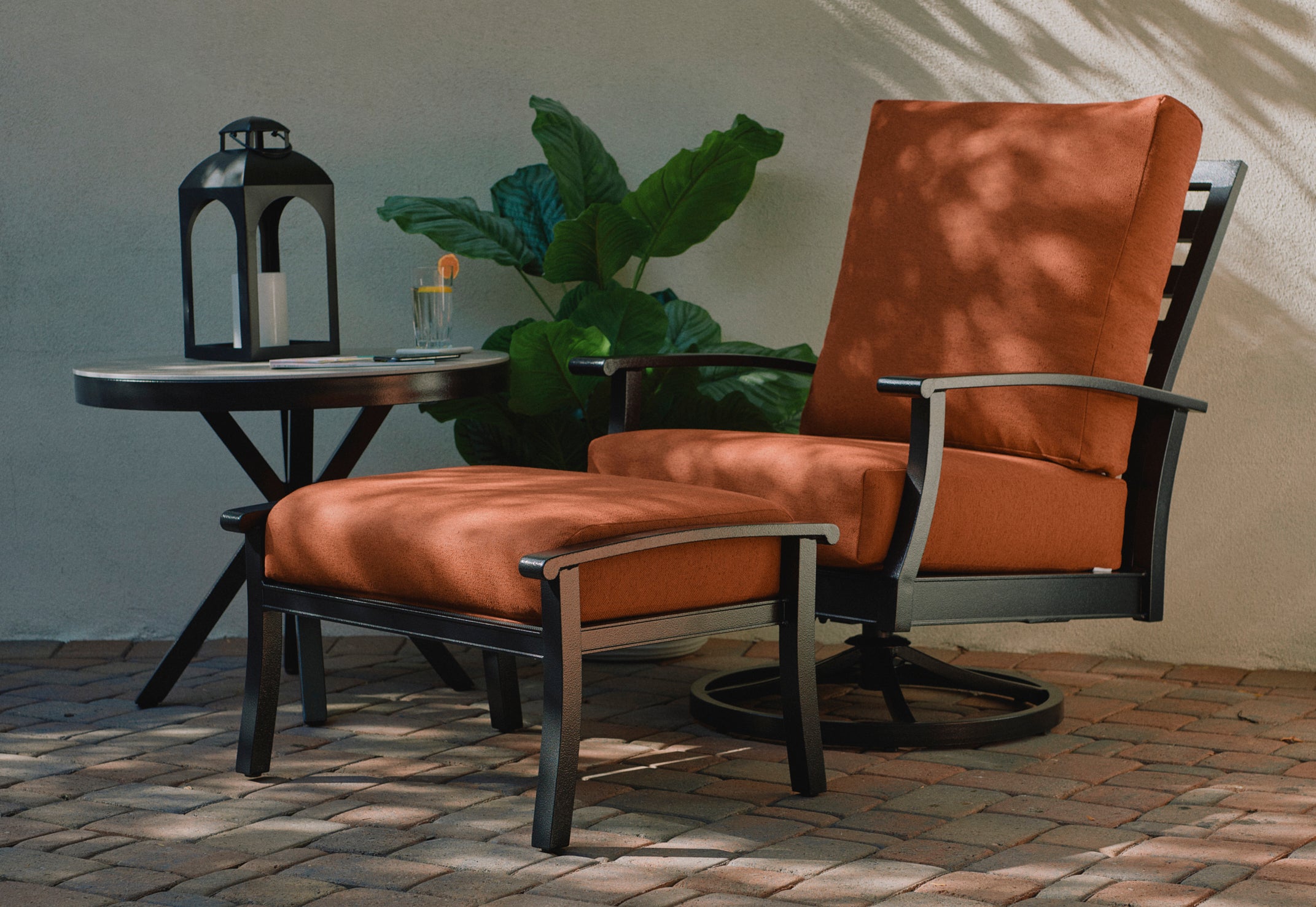 Paddy O’ Furniture’s Newport High Back swivel rocker and ottoman with Sunset Bliss Cushions.