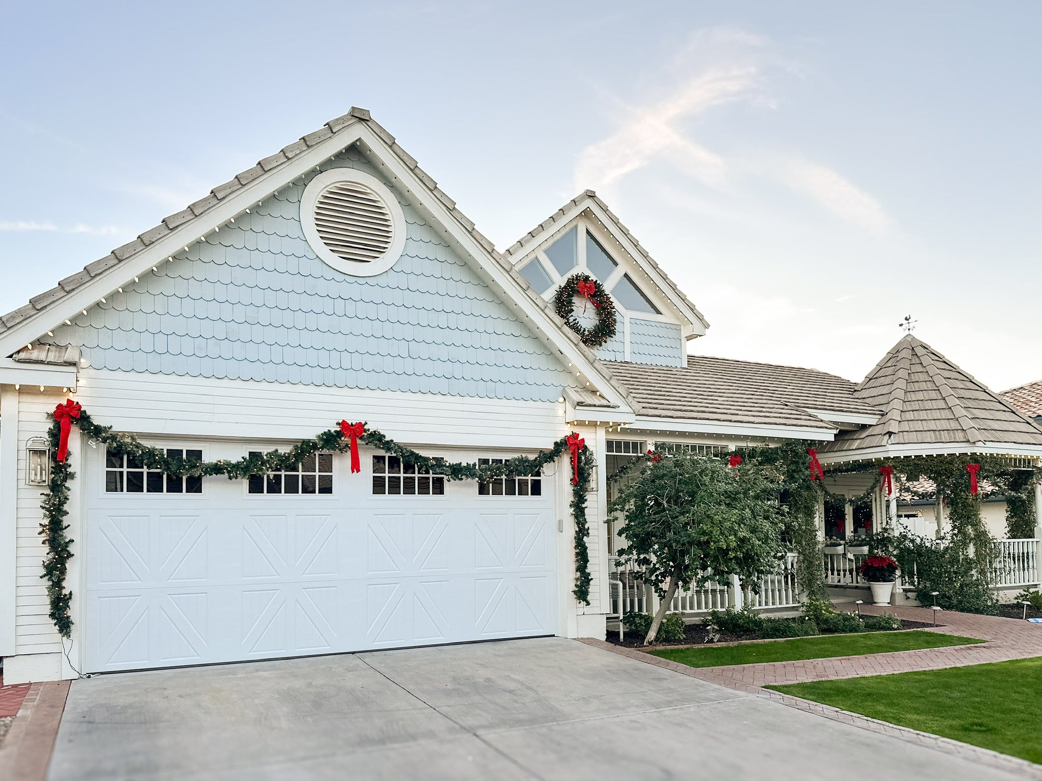 Front of House With Garland and Other Christmas Decor