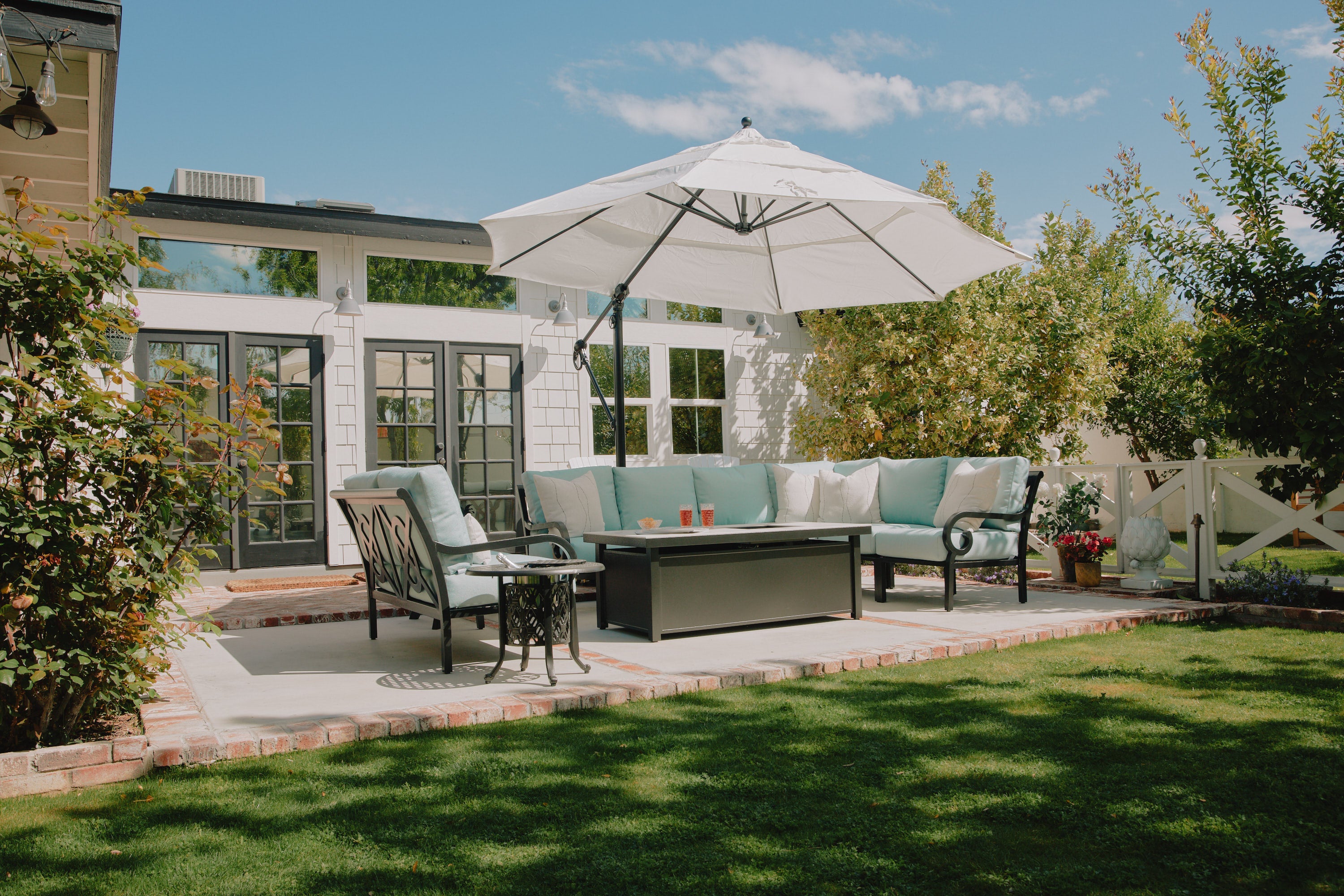 Paddy O' Furnitures Rancho Collection with a Dekton Fire Table and an aluminum table top