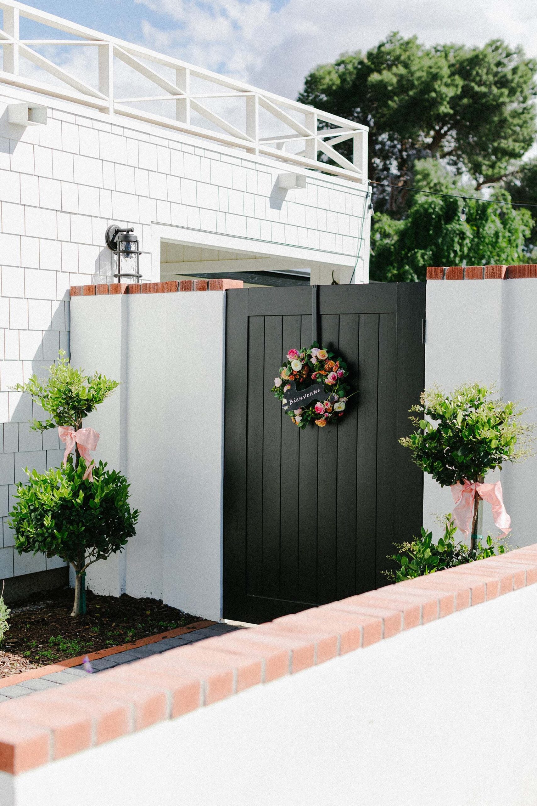 Outdoor Gate to Backyard with Decor