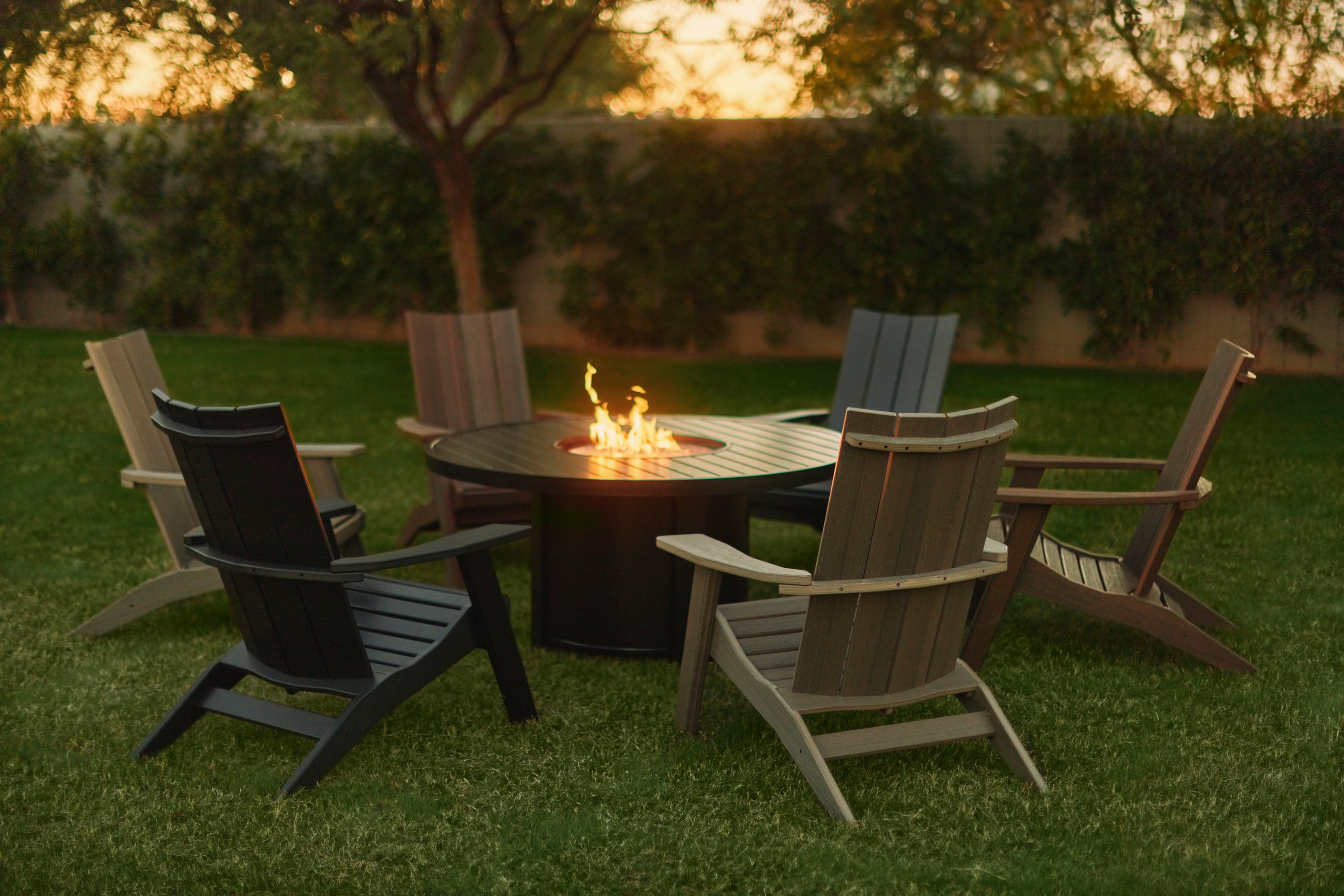 California Style Adirondack Chairs Around a Bliss Fire Pit Table