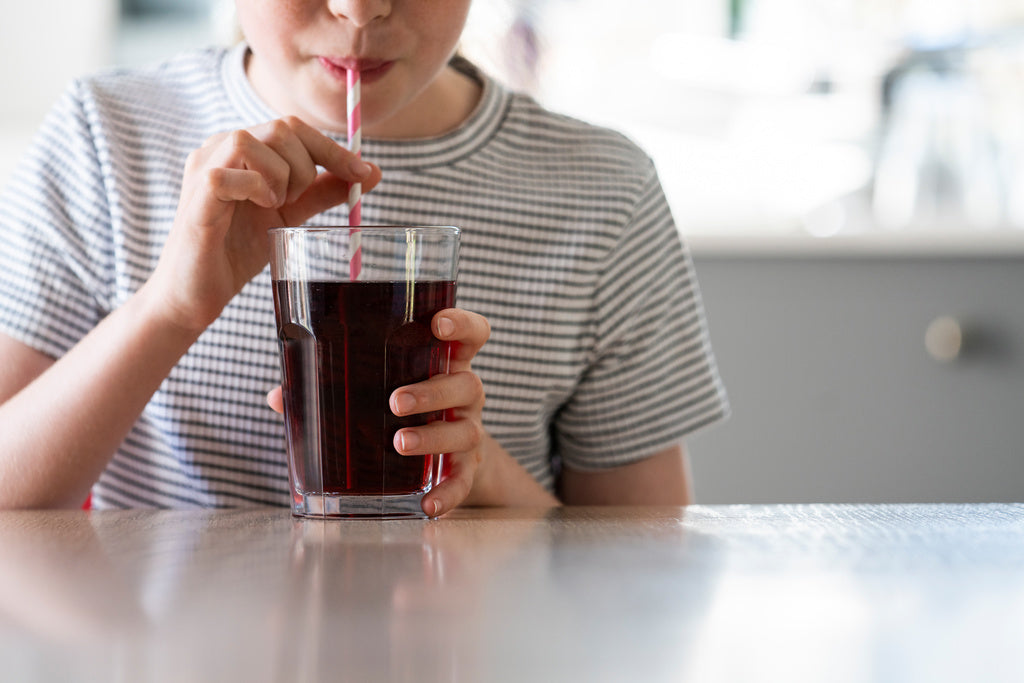 kid drinking coke