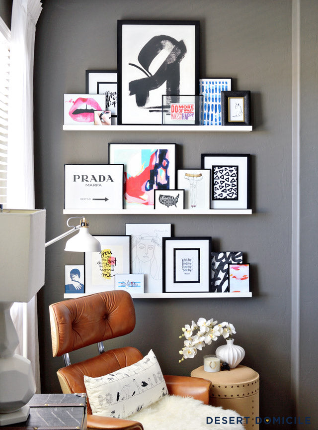 arrangement-of-frames-on-floating-shelves