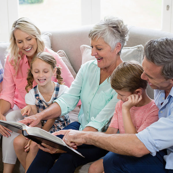 Family enjoying a large photo album together